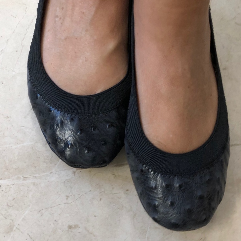 Black embossed leather flats